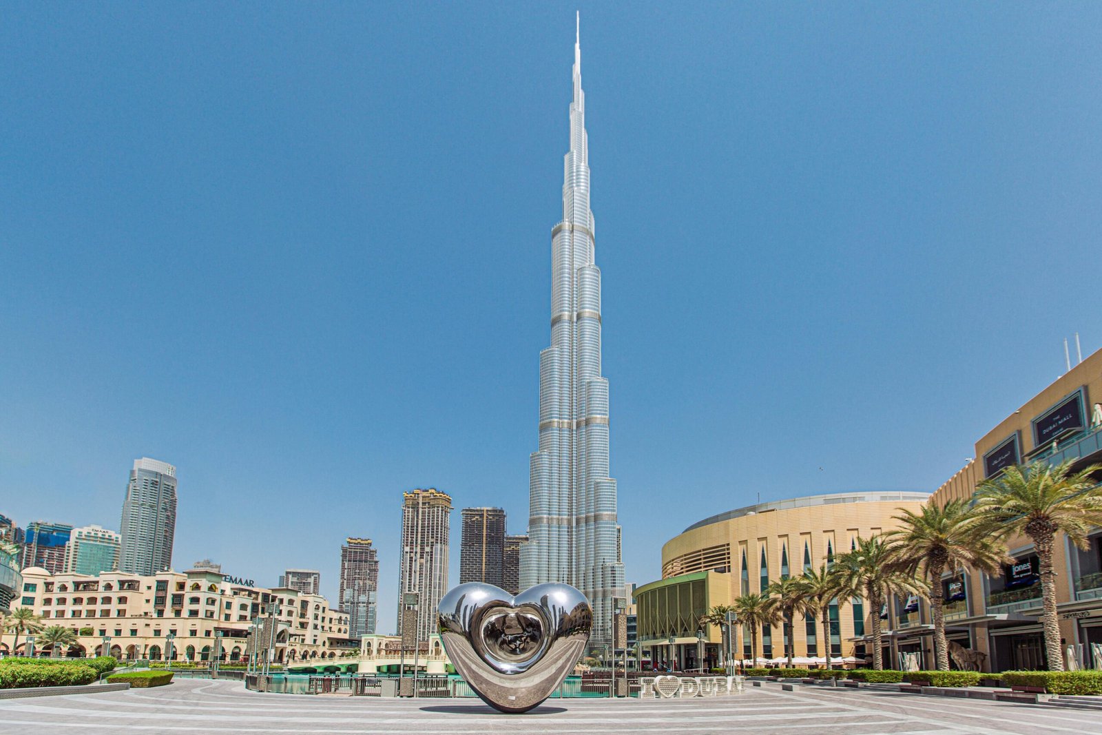 Stunning view of Burj Khalifa with contemporary art installation against a clear sky in Dubai.